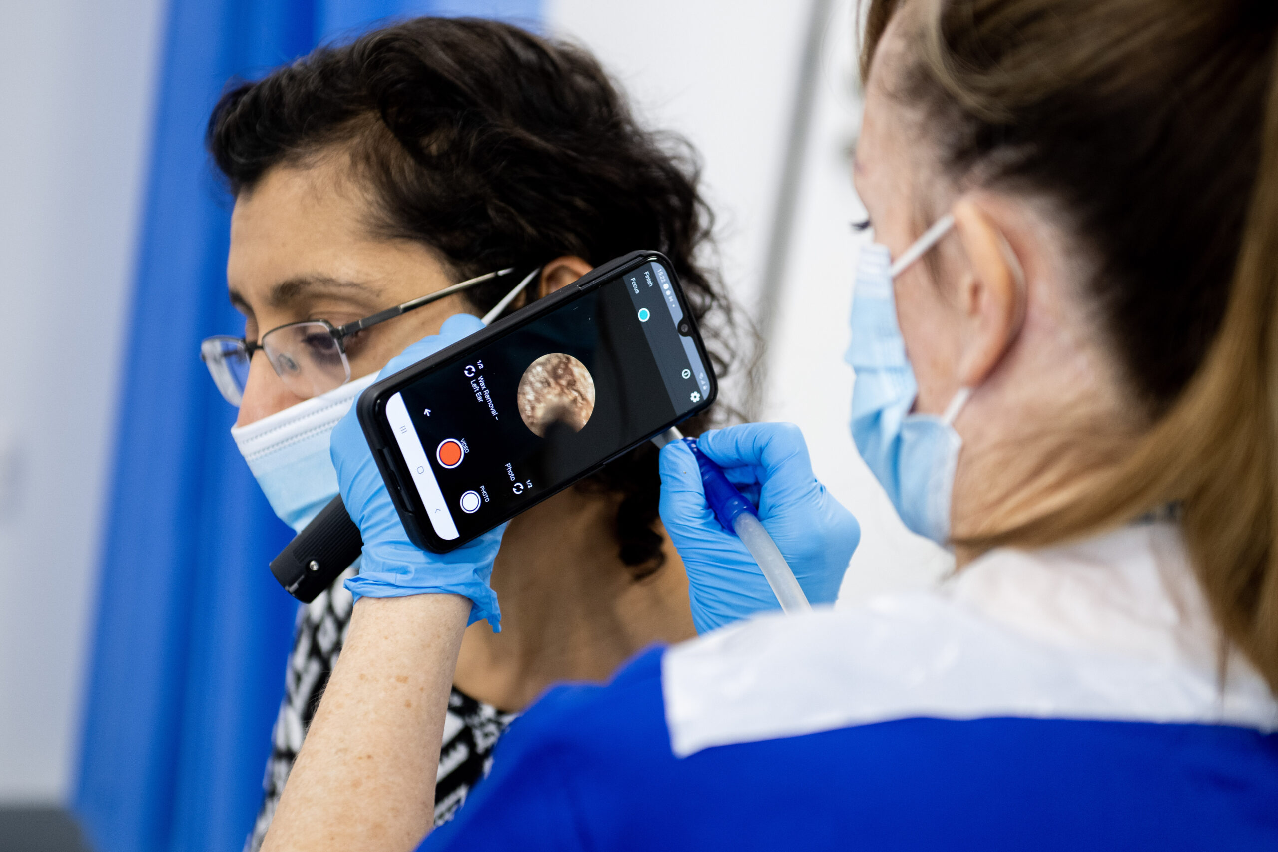 Patient receiving ear wax removal